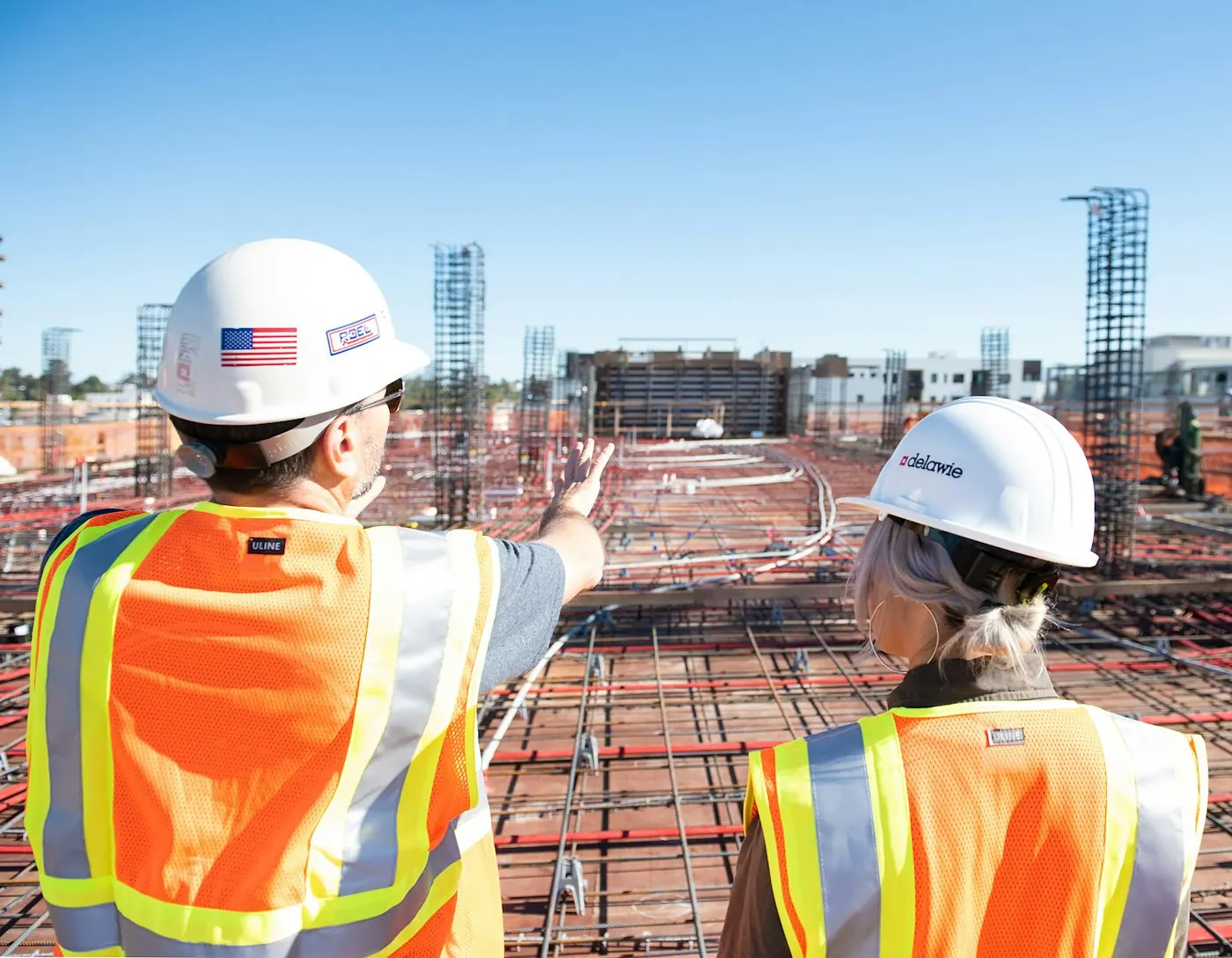 Construction professionals coordinating work on site